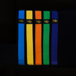 5 WAIT regalia sashes of multiple colours with gold terraform WAIT logo on a black background