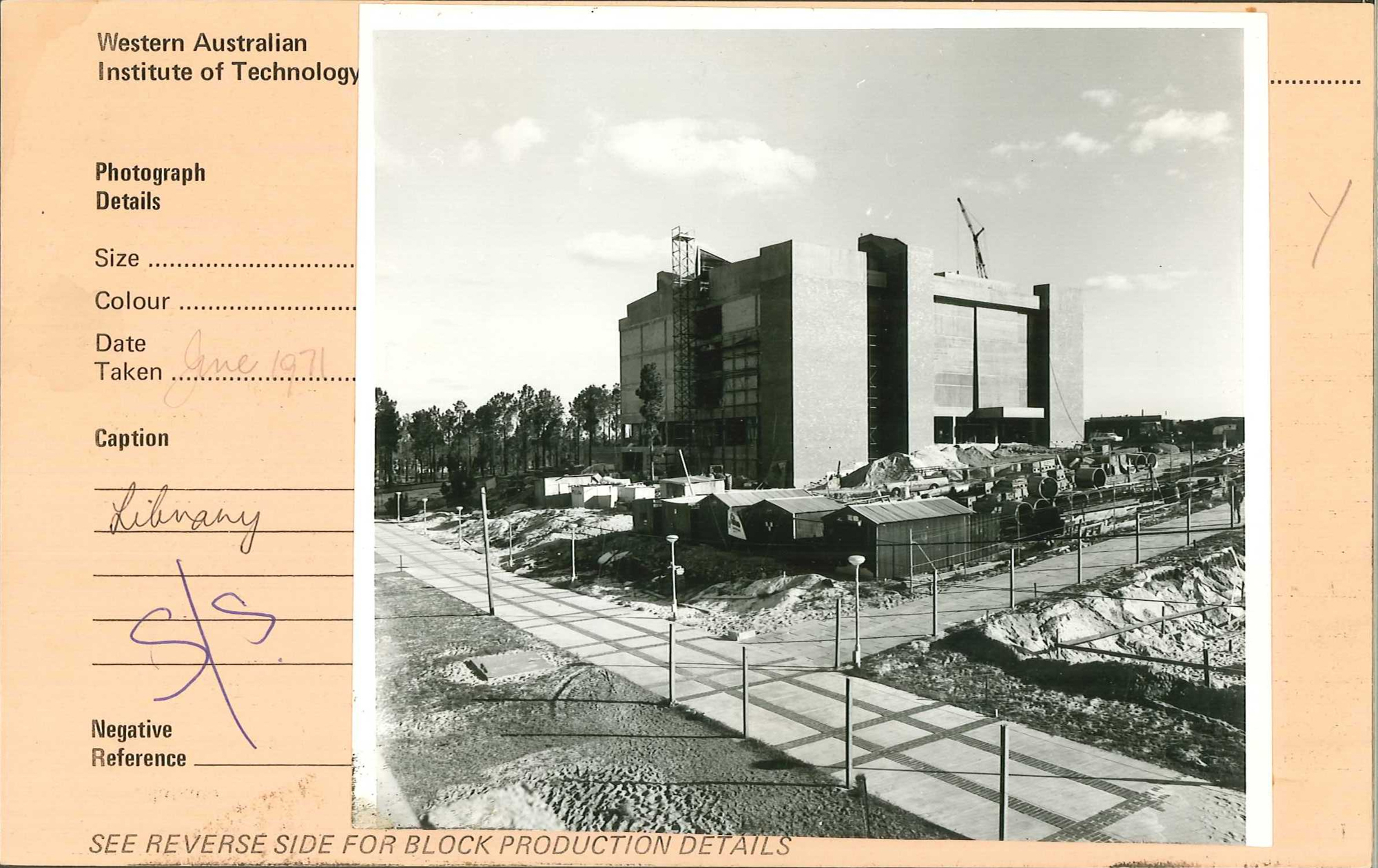 black and white construction photo of the library being built, on an orange card that reads "June1971"
